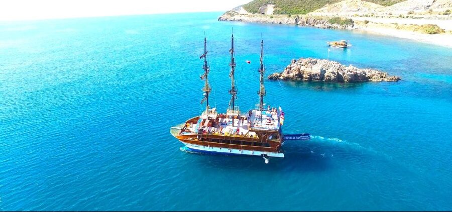 Alanya: Catamaran Boat Trip with Swim Stops and Sunbathing - Seeing the Red Tower and old shipyard from offshore