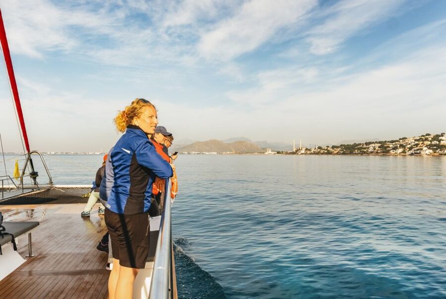 Alcudia: Sunset Catamaran Tour with Dinner and Snorkeling - Sailing north as the light softens