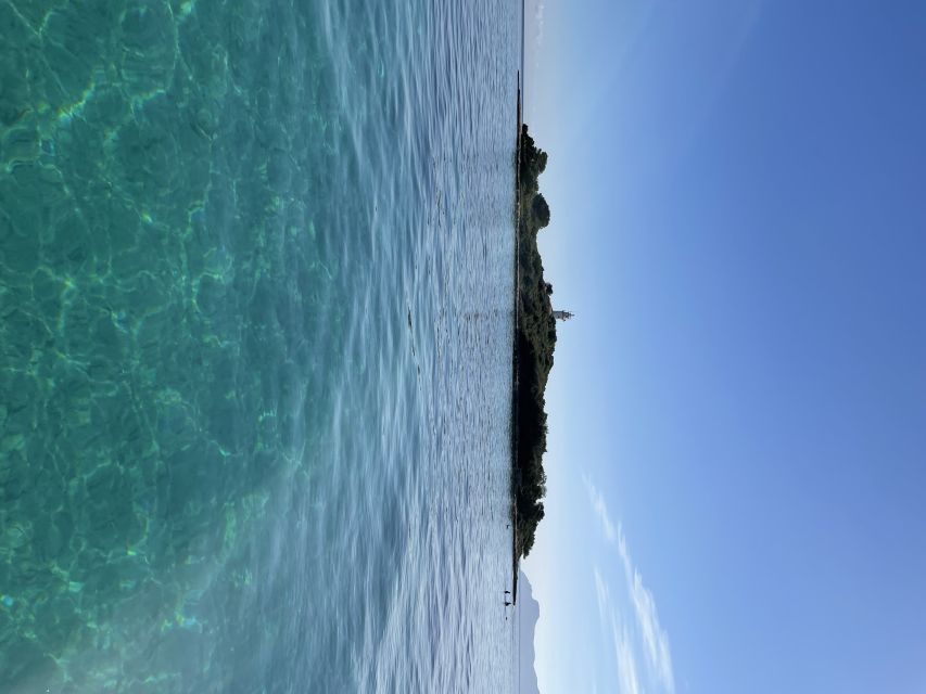 Alcudia: Traditional Wooden Boat Trip with Snorkeling - Aucanada Lighthouse and the second swim