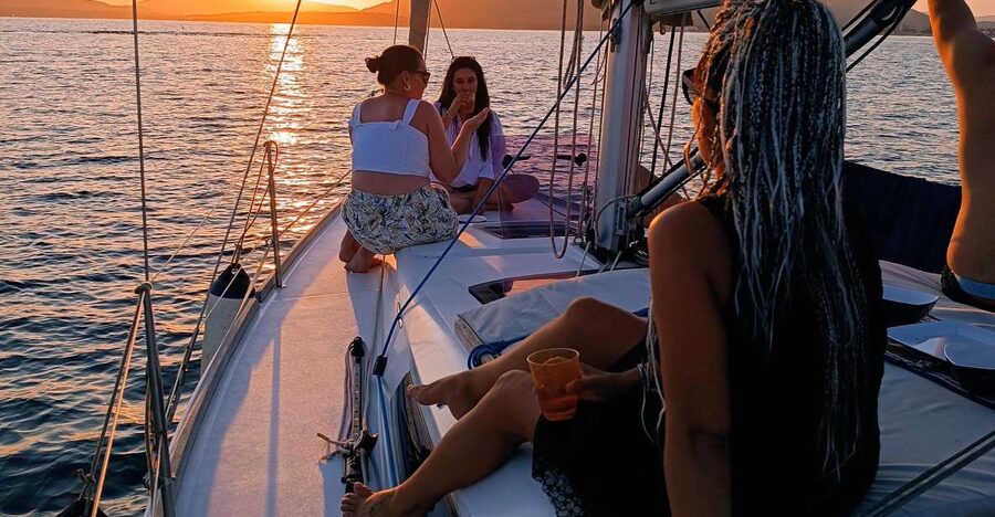 Alghero: Sunset Sailing Aperitif Experience - Swimming, snorkeling, and the last light of day
