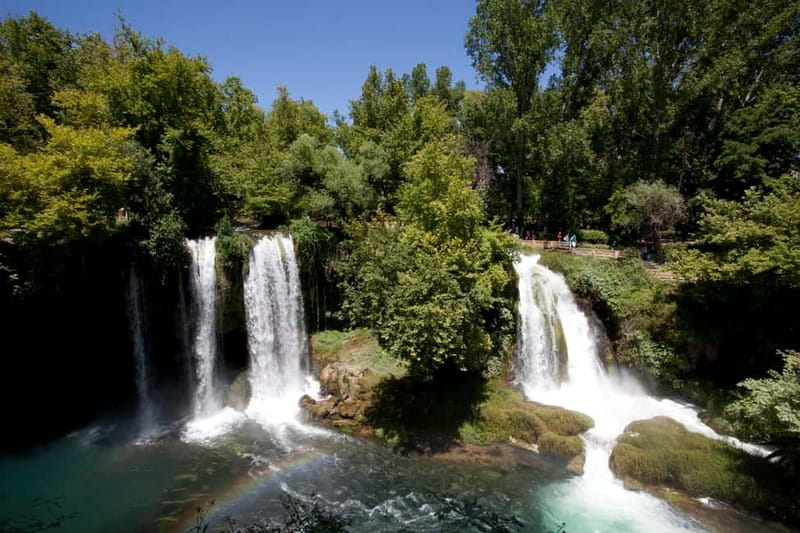 Antalya Private City Tour Waterfalls and Old Town Boat Tour - Behind the water at Upper Düden Falls