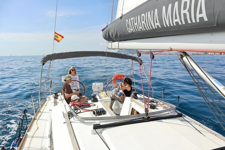 Barcelona: Coastline Boat Trip with Snacks and Cava - A swimming stop in clear Mediterranean water