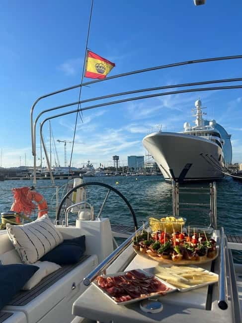 Barcelona: Sailing Tour + Food, Drinks, Swim & Sunset Option - Sailing through the harbor and along Barcelona’s coast