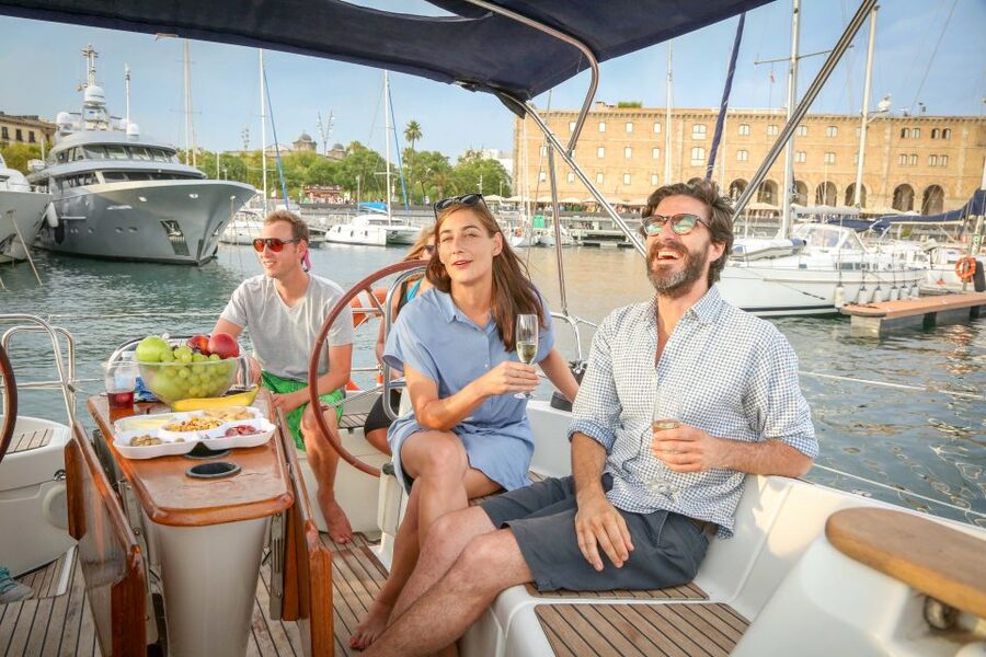 Barcelona: Sailing Tour with Spanish Tapas and Drinks - Boarding at Port Olímpic and settling aboard Bombon