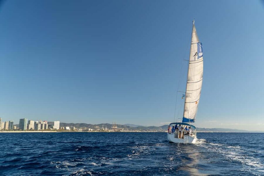 Barcelona: Sailing with Open Bar, Catalan Snack & Swim Stop - The two-hour return sail and sunset choice