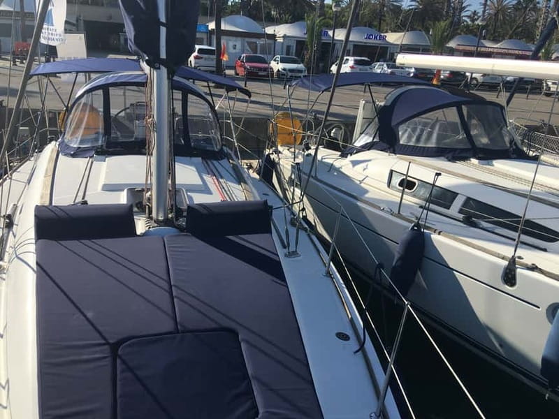 Barcelona: Sunset Boat Trip with Cava Wine and Snacks - Swimming, sunbathing, and taking the wheel