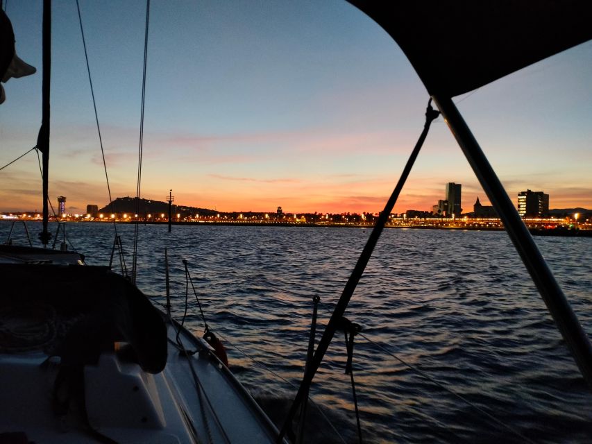 Barcelona: Sunset Cruise with Snacks and Drinks - The skipper and the group atmosphere