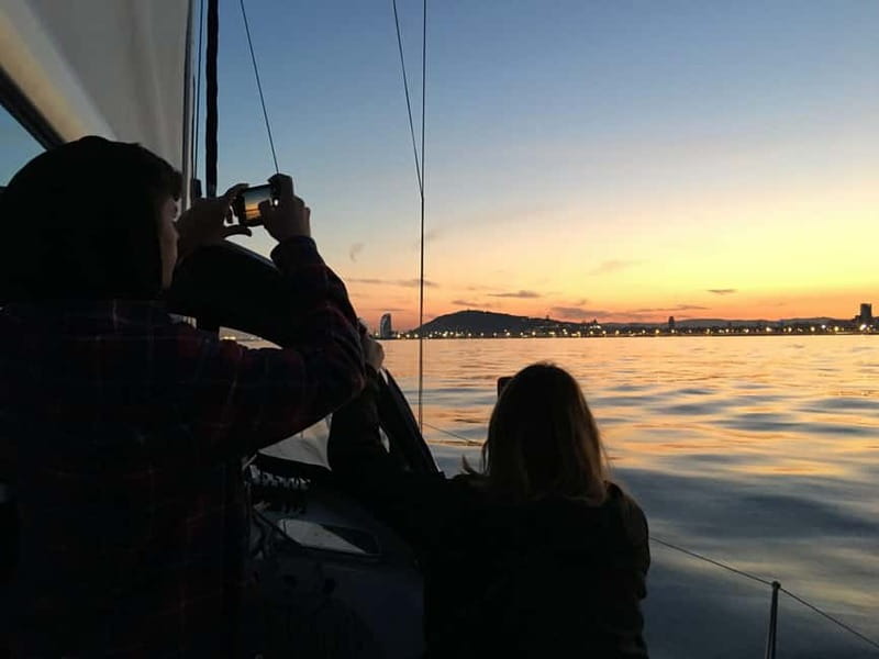 Barcelona: Sunset Sailboat Cruise with Open Bar and Snacks - Along the coast toward Barceloneta Beach
