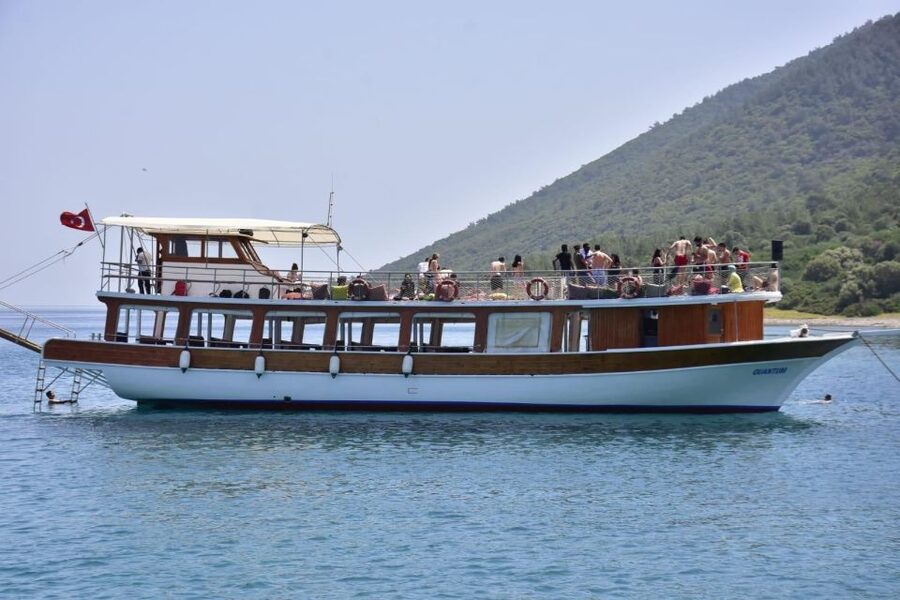 Bodrum: Orak Island Boat Tour with Swim Stops and Lunch - Boarding a two-deck boat from Bodrum