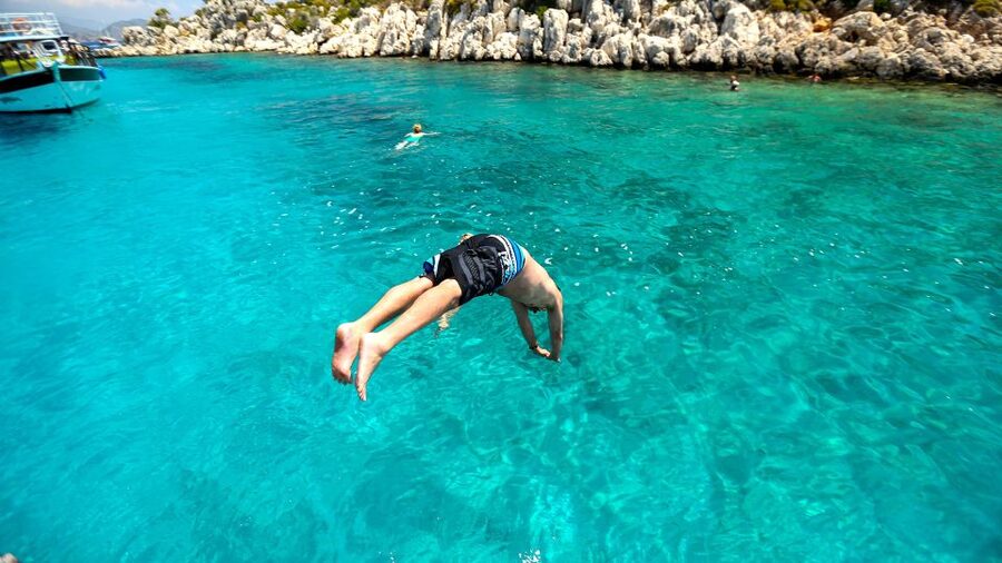 Bodrum: Orak Island Boat Tour with Swim Stops and Lunch - Red Nose Bay brings gray rock and blue water