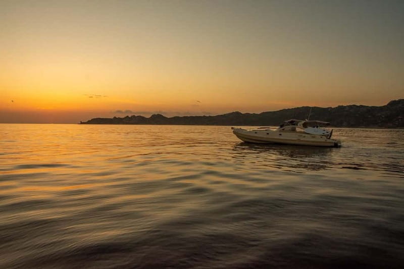 Bonifacio: Sunset Aperitif Dining Boat Tour - The Calanque of Fazzio swimming stop