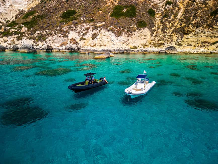Cagliari: Boat Tour with 5 Snorkeling Stops & Free Drinks - Sella del Diavolo: cliffs and clear water