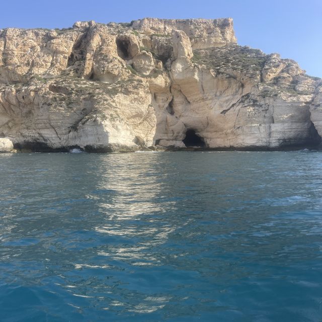 Cagliari: Boat Tour with Swim Stops, Snorkeling, & Aperitif - Cala Mosca and the coastal view