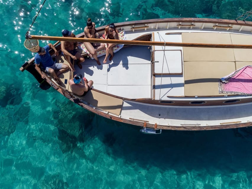 Cagliari: Classic Boat tour along the gulf with tasting. - The final stop pairs swimming with Sardinian snacks