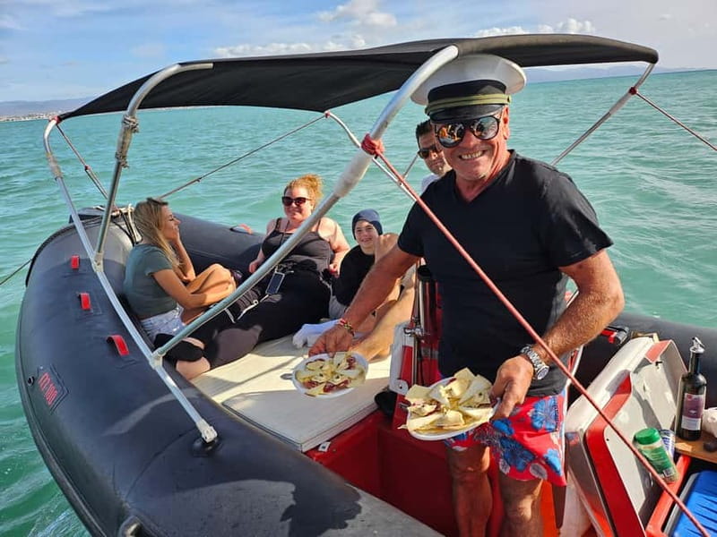 Cagliari: Sella del Diavolo Boat Magic Tour Drinks & Snacks - Cala Mosca pairs scenery with a guided stop