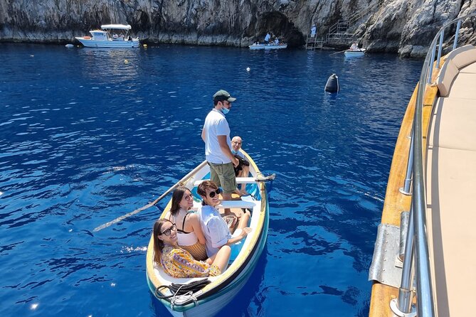 Capri Blue Grotto Small-Group Boat Day Tour From Sorrento - Grottos, lighthouse views, and the Faraglioni