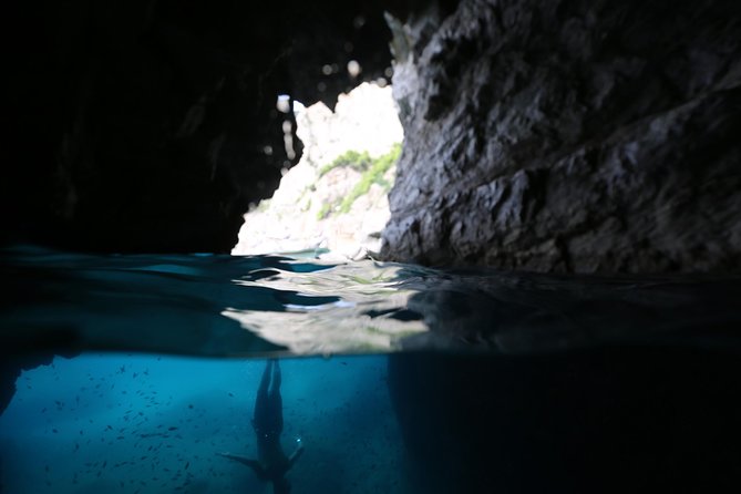 Capri Boat tour from Positano with Light Lunch, Drinks & Swim - Capri’s cliffs, villas, and sea stacks