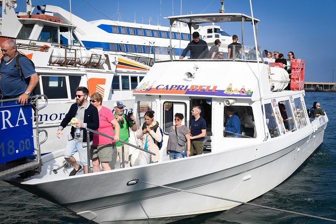 Capri Coast to Coast: Boat Tour with Optional Blue Grotto - Passing through the Faraglioni and Arch of Love