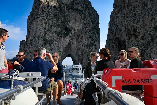 Capri Coast to Coast: Boat Tour with Optional Blue Grotto - A clockwise view of Capri’s caves
