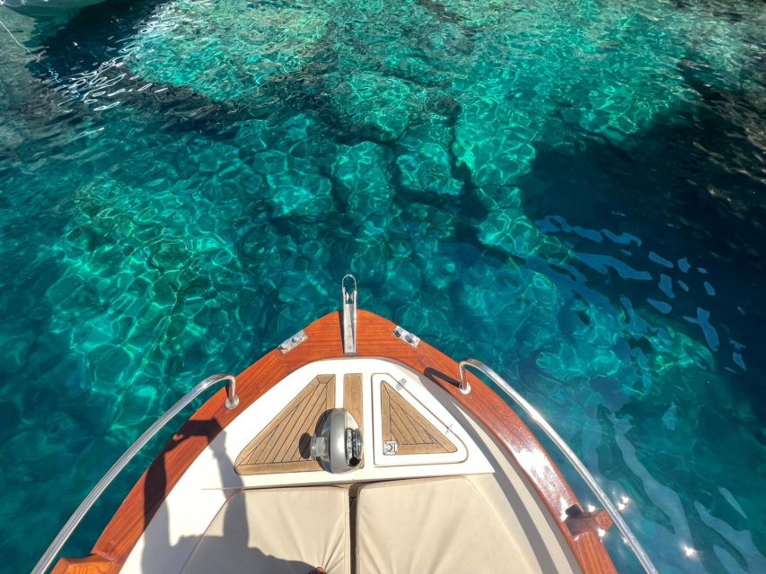 Capri: Private Island Boat Tour for Couples - Passing the Faraglioni Rocks on a private boat