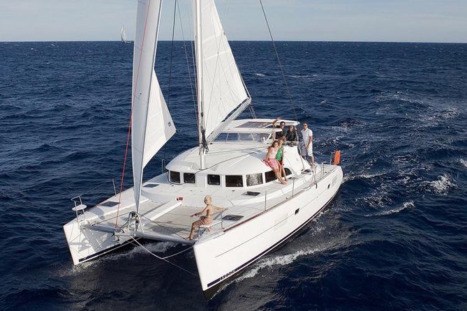 Catamaran Day & Sunset Cruises with meals Drinks and transportation - Sailing Past BAOS and Toward Delos