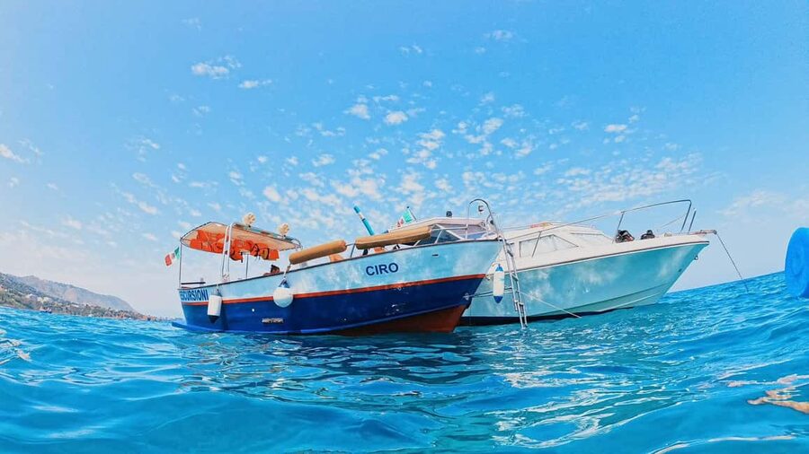 Cefalù: Coast-to-coast boat day trip with snorkeling and aperitif - Mazzaforno Beach: the first swim