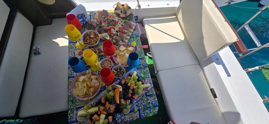 Cefalù: Coast-to-coast boat day trip with snorkeling and aperitif - What the small-group format feels like