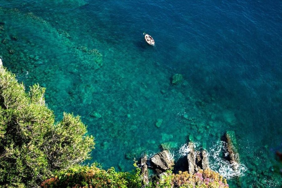 Cinque Terre: Hybrid Boat Tour with Swimming Stop - Manarola’s houses above the rocky shore