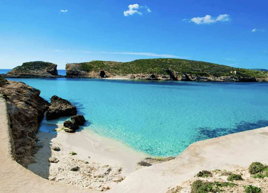 Comino: Mystic Caves, Blue and Crystal Lagoon Boat Cruise - Crystal Lagoon: cliffs, shade, and a change of scene