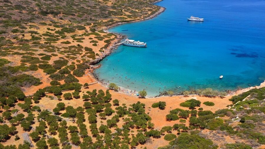Crete: Mirabello Bay Cruise with Onboard Cocktail - Cocktail, fruit, and food on board