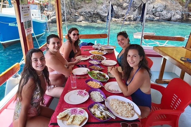 Daily Boat Trip - At least four places to swim and snorkel