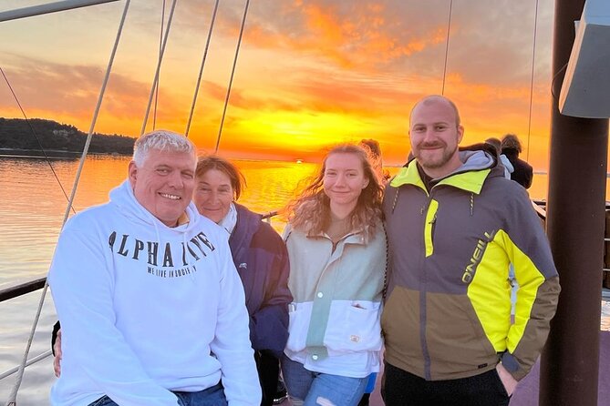 Dolphin Watching & Sunset Boat Tour With Dinner and Drinks - Crossing Pula Bay and its old defenses