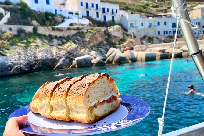 Egadi Islands Tour Favignana Levanzo by Boat with Lunch from Trapani - Cala Azzurra and Bue Marino: an easy start to the swimming