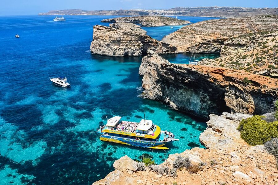 From Bugibba: Blue Lagoon Afternoon Swim with Sunset Cruise - Blue Lagoon: beautiful, popular, and worth seeing late