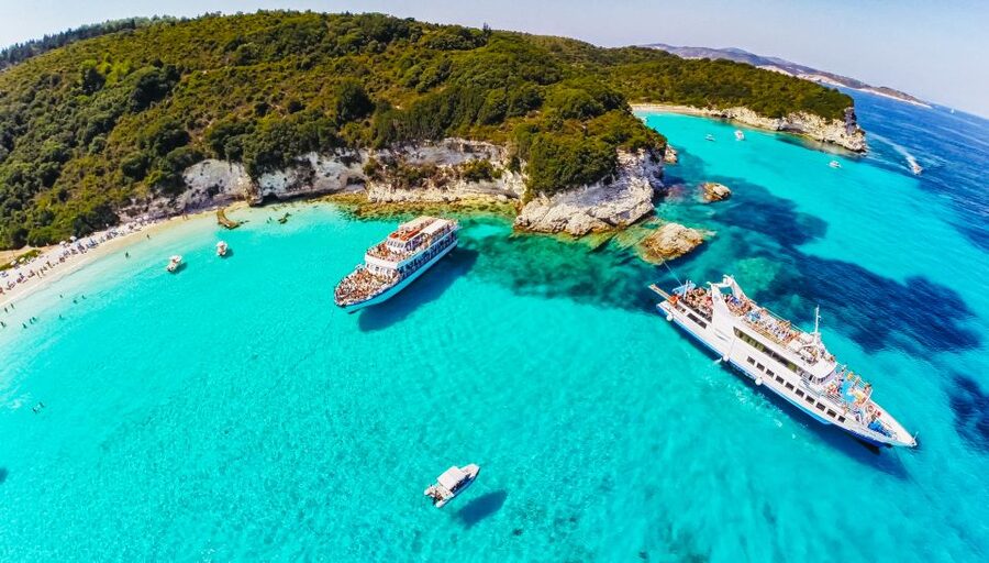 From Corfu: Day Cruise to Paxos, Antipaxos, and Blue Caves - Along Paxos, where white beaches meet dark rock