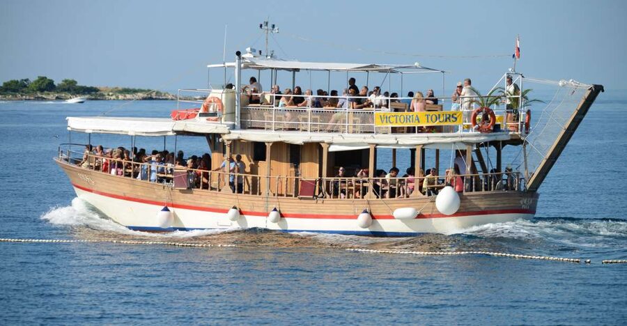 From Poreč: Lim Fjord, Rovinj, and Vrsar Boat Trip - Boarding the traditional wooden boat