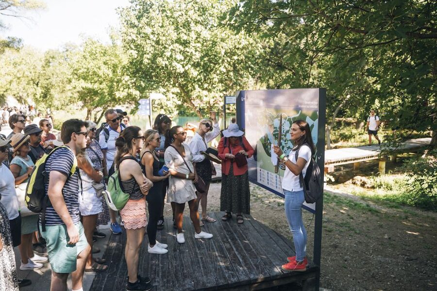 From Split: Krka Waterfalls Tour with Boat Cruise & Swimming - Walking the wooden paths at Skradinski Buk