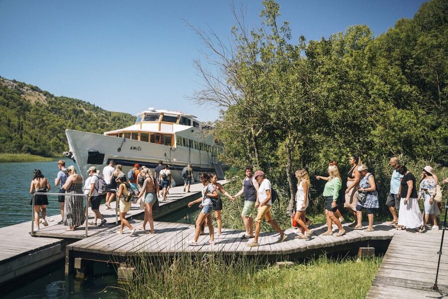 From Split: Krka Waterfalls Tour with Boat Cruise & Swimming - The panoramic boat ride toward Skradin