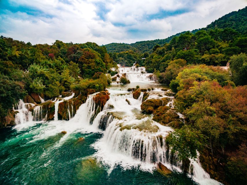 From Split & Trogir: Krka Waterfalls Day Tour with Boat Ride - Walking through Skradinski Buk