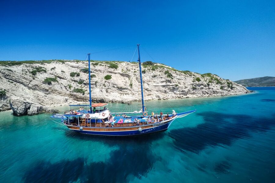 From the Port of Kos: Full Day Boat Cruise to 3 Islands - Crew, music, and the mood on board
