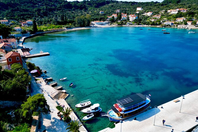 A day boat anchored over clear water off the Elaphite islands, Croatia