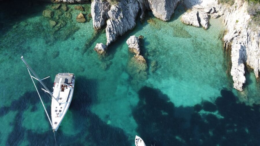 Gouvia: Corfu Island Sailing Trip with Snack and Soft Drinks - Barbati Beach brings the first clear-water stop