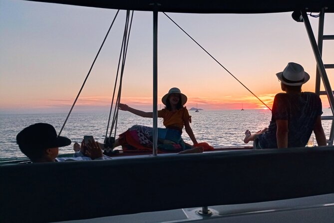 Half-Day Exclusive Catamaran Cruise in Santorini with Meal and Open Bar - Open bar, crew service, and the social mood