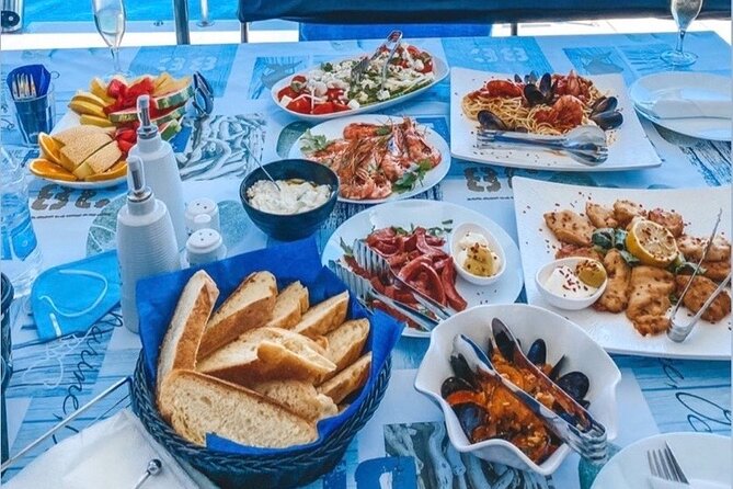 Half-Day Exclusive Catamaran Cruise in Santorini with Meal and Open Bar - The return route and Santorini from the water