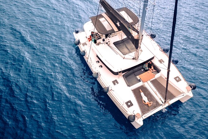 Half Day Premium Catamaran Cruise in Santorini including Oia - The Red Beach stop, 25 minutes by the water