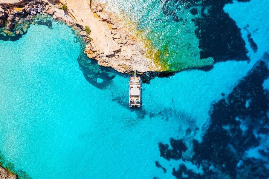 Ibiza: Beach Hopping Cruise w/ Paddleboard, Food, & Drinks - Cala Tarida and Cala Comte: two different coastal moods