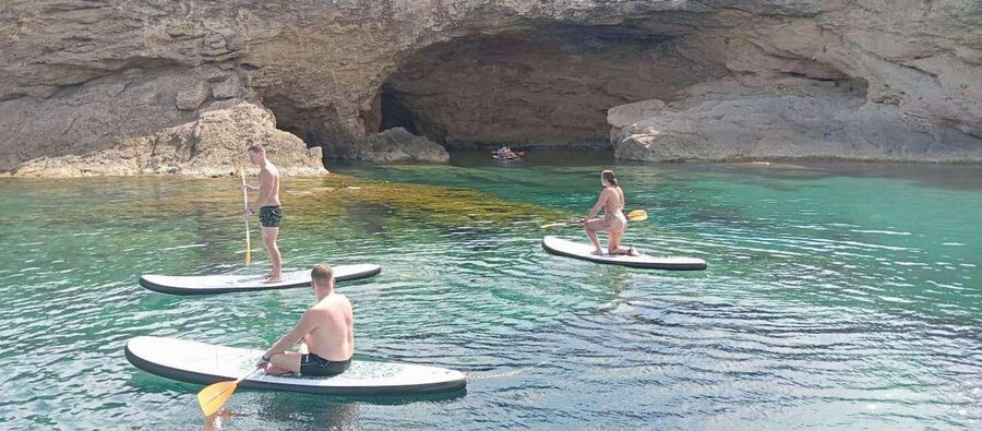 Ibiza: Snorkeling, Sunset Beach and Cave Boat Trip - Cruising Toward Cala Comte