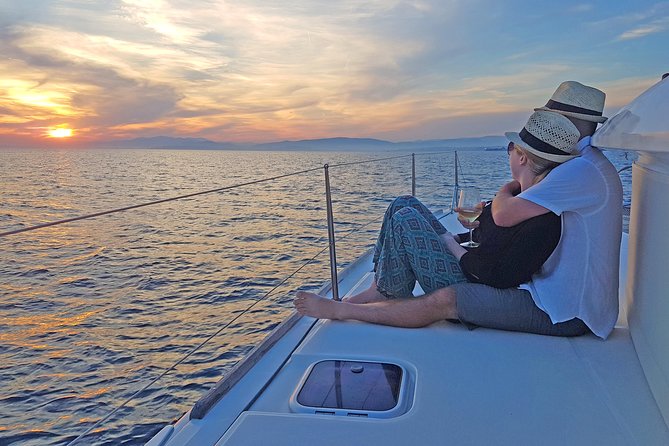 Luxury Catamaran Cruise from Athens with Traditional Greek Meal and BBQ - The first swimming stop, towels, and sea time