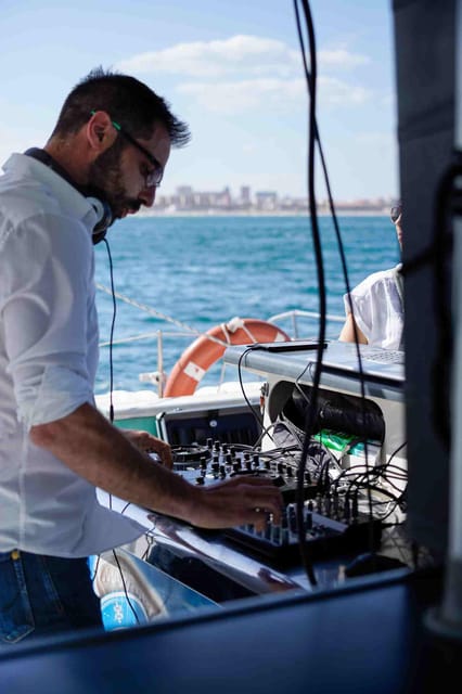 Malaga: Catamaran Sailing Cruise with Swimming & Optional DJ - Drinks, music, and the mood onboard