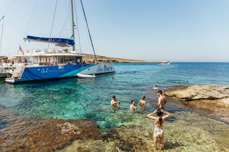 Malta: Blue Lagoon, Beaches & Bays Trip by Catamaran - Crystal Lagoon and the caves below the cliffs